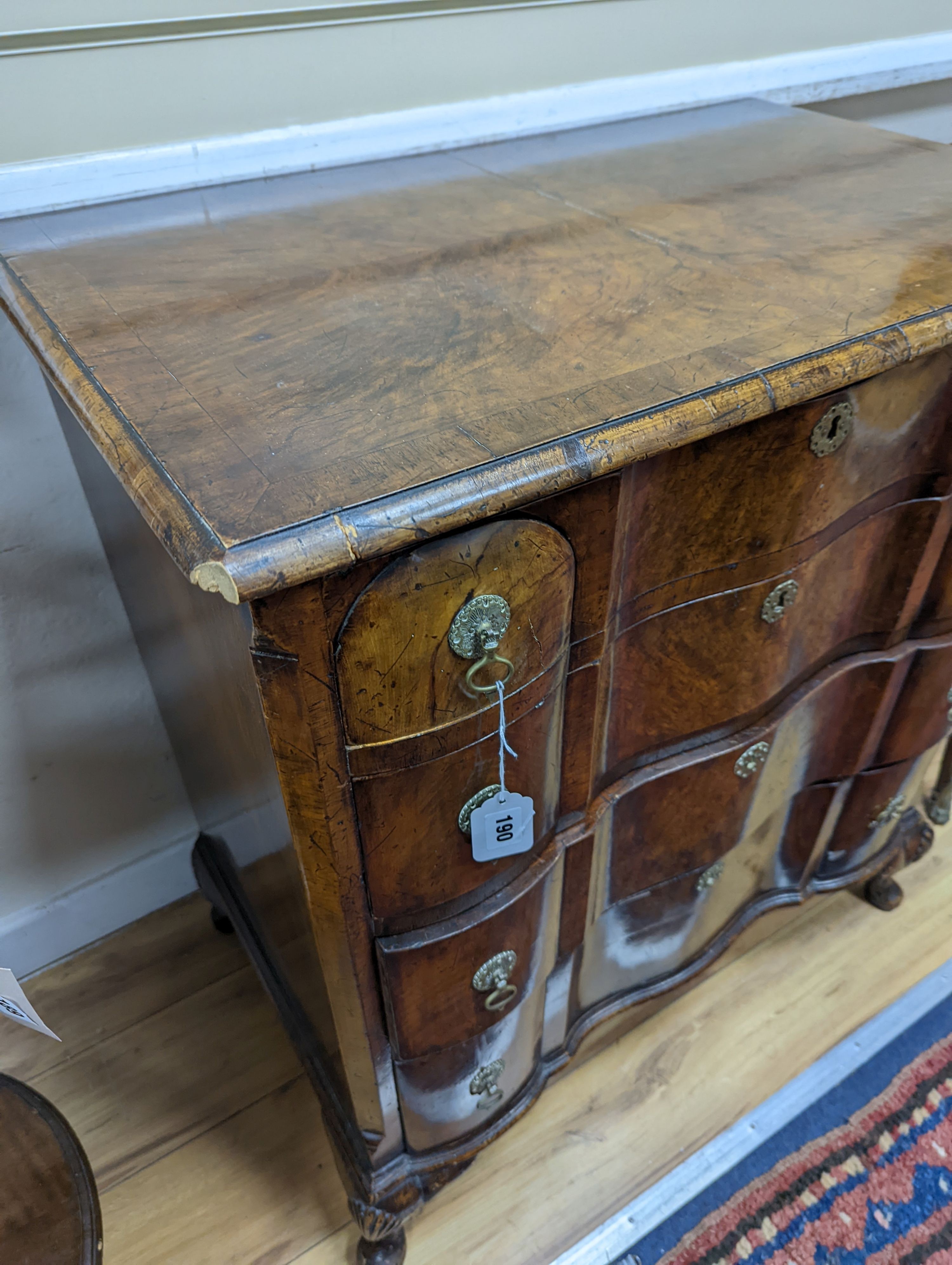 An early 20th century Queen Anne revival banded walnut shaped front chest, width 77cm, depth 46cm, height 85cm